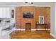 Stylish living room with exposed brick wall and hardwood floors at 639 25Th St, Denver, CO 80205
