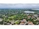 Panoramic aerial view of the townhouses near a park and lake in a serene, lush environment at 8406 Everett Way # C, Arvada, CO 80005