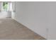 This bedroom is bright and spacious, with neutral carpet, a window, and an electrical outlet at 8406 Everett Way # C, Arvada, CO 80005