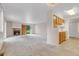 Bright, open living space with a fireplace, kitchen, and door to the outdoors at 8406 Everett Way # C, Arvada, CO 80005