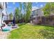 Lush backyard with a green lawn and a patio area, perfect for relaxation at 1462 Hyacinth Way, Superior, CO 80027