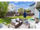 Inviting backyard featuring a patio with lounge furniture and well-maintained lawn at 1462 Hyacinth Way, Superior, CO 80027