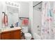 Well-lit bathroom featuring a shower-tub combo and stylish pink towels at 1462 Hyacinth Way, Superior, CO 80027