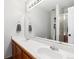 Bright bathroom features double sinks, a large mirror, updated fixtures, and a walk-in shower at 1462 Hyacinth Way, Superior, CO 80027