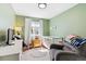 Cozy Bedroom features a crib, comfortable armchair, and bright green walls, creating a welcoming space at 1462 Hyacinth Way, Superior, CO 80027