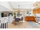 Bright dining area featuring hardwood floors, an open floorplan, and contemporary lighting at 1462 Hyacinth Way, Superior, CO 80027