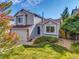 Charming two-story home with a well-manicured front yard and attached garage on a sunny day at 1462 Hyacinth Way, Superior, CO 80027