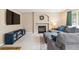 Comfortable living room features a fireplace, large sectional sofa, and modern entertainment center for relaxation at 1462 Hyacinth Way, Superior, CO 80027
