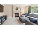 Inviting living room showcases a fireplace, large sectional sofa, and an area rug for comfortable and stylish living at 1462 Hyacinth Way, Superior, CO 80027