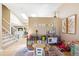 Open playroom with skylights, a staircase and a view to the dining room provides an airy atmosphere at 1462 Hyacinth Way, Superior, CO 80027