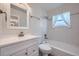 Bathroom with vanity, mirror, shower and a window letting in natural light at 13472 E Dakota Ave, Aurora, CO 80012