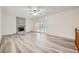 Spacious living room with fireplace, wood floors, natural light from french doors, and neutral walls at 13472 E Dakota Ave, Aurora, CO 80012