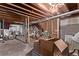 Unfinished basement with exposed beams, boxes, and bicycle at 309 Pheasant Run, Louisville, CO 80027