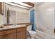 Bathroom with a vanity, sink, toilet, and bathtub at 309 Pheasant Run, Louisville, CO 80027