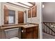 Bathroom featuring a vanity, sink, and a wooden cabinet at 309 Pheasant Run, Louisville, CO 80027