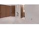 Bedroom with closet and open door to bathroom and hallway at 309 Pheasant Run, Louisville, CO 80027