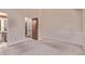 Bedroom with carpet flooring, neutral wallpaper, closet, and ensuite potential at 309 Pheasant Run, Louisville, CO 80027