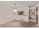 Cozy dining room area with a view into the kitchen and neutral tones at 309 Pheasant Run, Louisville, CO 80027