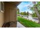 Exterior showing a side door entrance and green landscape at 309 Pheasant Run, Louisville, CO 80027