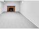Finished basement features a brick fireplace and new carpet at 1810 S Kearney St, Denver, CO 80224