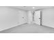 Basement featuring neutral carpet with doorway access to another room at 1810 S Kearney St, Denver, CO 80224