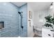 Modern bathroom featuring a tiled shower, sleek fixtures, and contemporary design at 1810 S Kearney St, Denver, CO 80224