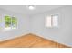 Bright bedroom with hardwood floors and two windows offering plenty of natural light at 1810 S Kearney St, Denver, CO 80224