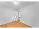 Unfurnished bedroom with hardwood floors, fresh paint, and natural light at 1810 S Kearney St, Denver, CO 80224