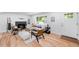 Inviting living room with large windows, hardwood floors, fireplace, and comfortable seating arrangement at 1810 S Kearney St, Denver, CO 80224