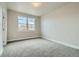 Bedroom with two windows and neutral-colored carpet at 2751 E 102Nd Pl, Thornton, CO 80229