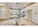 Stylish kitchen featuring an island, sleek black countertops, and stainless steel appliances at 2751 E 102Nd Pl, Thornton, CO 80229