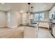 Beautiful kitchen with a center island, white cabinetry, and stainless steel appliances at 2751 E 102Nd Pl, Thornton, CO 80229