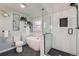 Luxurious bathroom with sleek tub, glass-enclosed shower, and modern finishes at 7823 S Locust Ct, Centennial, CO 80112