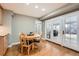 Cozy breakfast nook with a round table, chairs, and bright light coming from the French doors at 7823 S Locust Ct, Centennial, CO 80112