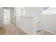 Bright upstairs hallway with carpet flooring and white walls at 3315 N Coolidge Way, Aurora, CO 80019