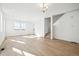 Bright and airy living room with light wood floors, white walls, and natural light at 3315 N Coolidge Way, Aurora, CO 80019