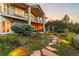 Enjoy an evening on the patio by the fireplace in this beautifully landscaped backyard at 6948 Fox Cir, Larkspur, CO 80118