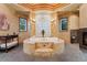 Luxurious bathroom with a soaking tub, fireplace, and elegant finishes at 6948 Fox Cir, Larkspur, CO 80118