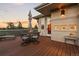 Outdoor deck with a table set and chairs with a view at 6948 Fox Cir, Larkspur, CO 80118