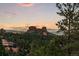 Panoramic landscape view features rolling hills and a picturesque sunset sky at 6948 Fox Cir, Larkspur, CO 80118