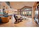 Spacious living room featuring recessed lighting, modern furniture, and a cozy fireplace at 6948 Fox Cir, Larkspur, CO 80118