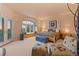 Bright main bedroom featuring a window seat and a four-poster bed at 6948 Fox Cir, Larkspur, CO 80118