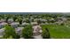 Aerial view of a charming home with a well-manicured lawn, surrounded by trees and greenery at 13753 Monroe St, Thornton, CO 80602