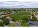 Stunning aerial shot of neighborhood, highlighting lush green spaces and mountain views at 13753 Monroe St, Thornton, CO 80602