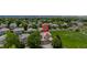 Aerial view of a charming home with a well-manicured lawn, surrounded by trees and greenery at 13753 Monroe St, Thornton, CO 80602