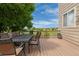 Outdoor dining on the private deck with views of the backyard is perfect for entertaining or relaxing in the sun at 13753 Monroe St, Thornton, CO 80602