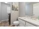 Convenient half bathroom and laundry area with neutral paint and stylish fixtures at 13753 Monroe St, Thornton, CO 80602