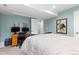 This bedroom features a bed, a desk, carpet flooring, and light-green walls at 13753 Monroe St, Thornton, CO 80602