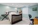 This bedroom features a window, a bed, carpet flooring, and light-green walls at 13753 Monroe St, Thornton, CO 80602