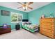Cozy bedroom filled with natural light, and featuring a large window with a great view at 13753 Monroe St, Thornton, CO 80602